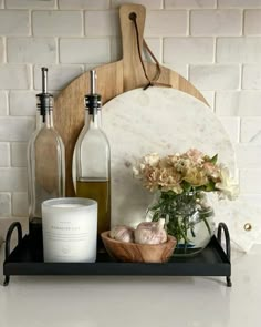 bottles and vases are sitting on a shelf