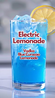 a blue curacao lemonade is garnished with a slice of lemon