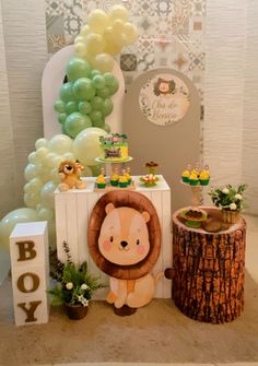 an animal themed birthday party with balloons and decorations