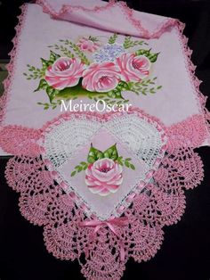 two doily with pink roses on them