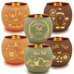 four different colored bowls with pumpkins, flowers and words painted on the side in gold