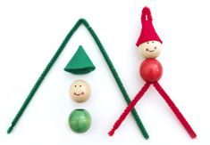 an assortment of toys made to look like christmas trees and elfs with faces on them