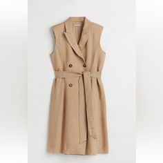 Fitted Sleeveless Jacket Dress In Woven Linen And Viscose Blend.Knee Length, Has Tie Belt, Pointed Lapels, Double Breasted Wrapover Front. Lined Elegant Spring Vest Dress, Chic Sleeveless Vest Dress For Spring, Chic Sleeveless Dress For Spring, Summer Workwear Vest Outerwear, Sleeveless Linen Outerwear For Fall, Sleeveless Summer Vest, Linen V-neck Outerwear For Work, Beige Sleeveless Dress For Spring Workwear, Beige Sleeveless Dress For Work In Spring