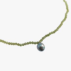 Experience the refined elegance of this necklace, composed of natural faceted Peridot beads and a striking blue baroque Akoya pearl. The centerpiece, an Akoya pearl, has a very good luster and is non-removable, providing an alluring focal point. A secure fit and an added layer of sophistication are ensured by a rhodium-plated 925 silver oval clasp. Pearl And Peridot, Light Green Color, Peridot Necklace, Elegant Necklace, Akoya Pearls, Elegant Necklaces, Rhodium Plated, Green Color, Natural Light