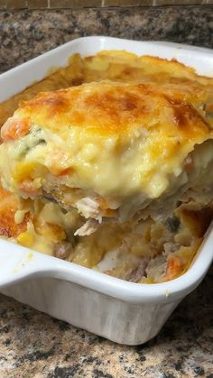 a casserole dish filled with meat and cheese