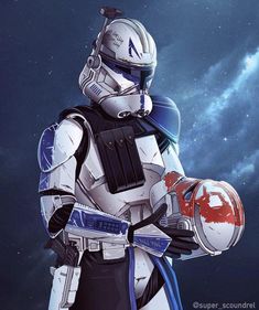 a star wars character holding a helmet in his hand