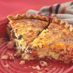 a slice of quiche on a red plate