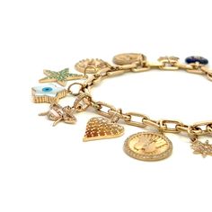 This 14K gold link bracelet features 11 charms and a diamond lobster clasp. Gold Link Bracelet, Gold Link, Link Bracelets, Lobster Clasp, Product Launch, Charm Bracelet, Charms, Bracelet, Gold