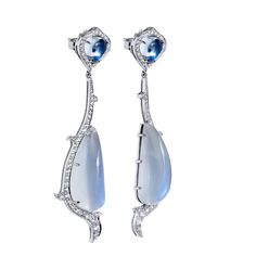 Known for its enchanting dance with light, the moonstone is a playful and intriguing stone that translates beautifully into jewelry design. Handmade in 18kt white gold, this set of earrings showcases 29.24ct crescent-shaped Milky Moonstone that are embraced by .99ct of F/G VS graded diamond pave. The diamonds and milky moonstone are suspended by 3.68ct moonstone pinned to the stem of the earring. SKU: 15832 Elegant Crescent Diamond Earrings, Luxury Moon Shaped Jewelry For Formal Occasions, Elegant White Crescent Earrings, Elegant Crescent Moonstone Jewelry, Elegant Moon-shaped Wedding Earrings, Elegant Moon Shaped Wedding Earrings, Elegant Moonstone Drop Earrings, Luxury Moonstone Jewelry For Formal Occasions, Elegant Moonstone Earrings For Formal Occasions