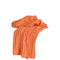 an orange blanket on a white background