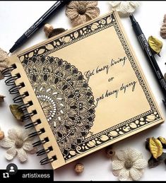 an open notebook sitting on top of a table next to crocheted doily