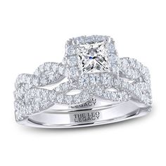 a princess cut diamond ring with two rows of diamonds on the band