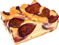 a piece of cake with fruit toppings sitting on top of it's crust