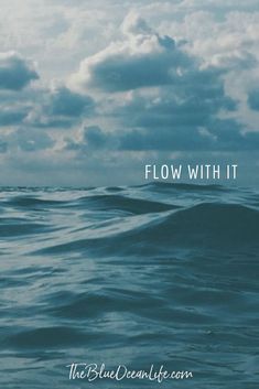 the blue ocean is full of waves and clouds with text below it that reads, flow with it