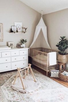 a baby's room with a crib, dresser and bed