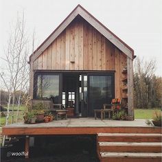 a wooden house with steps leading up to it