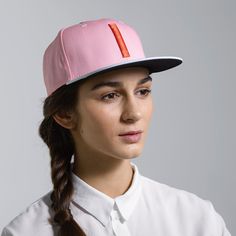 The Blinky is a classic six-panel, baseball-style cap in pink with a contrasting light blue brim and raised embroidery detail in orange. All March Caps feature top eyelets and an adjustable snap-back closure. Each cap comes with a hand-numbered card signed by the designer. Pink Baseball Cap With Flat Bill, Pink Snapback Fitted Hat, Pink Snapback Fitted Hat Casual Style, Pink Flat Bill Sports Hat, Casual Pink Snapback Fitted Hat, Pink Flat Bill Trucker Hat For Spring, Pink Sports Visor Baseball Cap, Adjustable Pink Snapback Hat For Streetwear, Pink Adjustable Snapback Hat For Streetwear