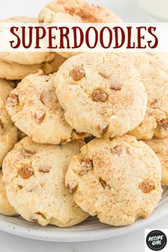 a plate full of cookies with the words super doodles on top and below it