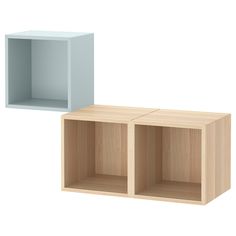 two empty wooden boxes sitting next to each other on a white background, one is blue and the other is light wood