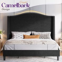 a black bed with white sheets and pillows