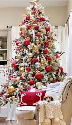 a christmas tree decorated with red and gold ornaments