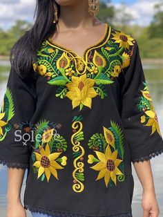 This Beautiful Mexican blouse is embroidered on an artisanal Machine using Silk Thread and it also has a hand knit neckline. It has beautiful flowers embroidered both on the front and also on the sleeves. This Blouse is truly a work of art and one of a kind. Bohemian V-neck Blouse With Multicolor Embroidery, Traditional Embroidered V-neck Peasant Top, Bohemian Multicolor Embroidered V-neck Top, Bohemian Blouse With Multicolor Embroidery For Fall, Fall Festival Blouse With Floral Embroidery, Fall Festival Floral Embroidered Blouse, Bohemian Embroidered V-neck Blouse, Traditional Peasant Top With Floral Embroidery For Fall, Bohemian Embroidered Blouse For Vacation