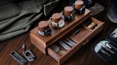 an assortment of barber accessories on a wooden table