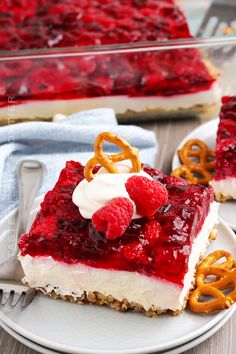 a piece of cheesecake with raspberry sauce and pretzels on top