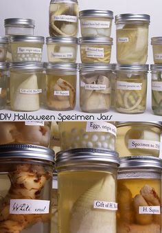 jars filled with different types of food and labeled with labels on the lids are shown