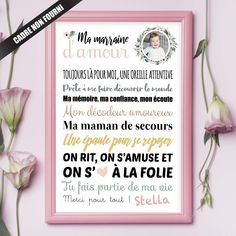 a pink frame sitting next to flowers on top of a purple wall with the words in french