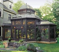 a large building with many windows in the middle of it's front lawn area