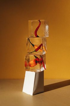 an ice cube sculpture with peppers on it