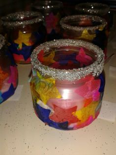 several jars with different colored stars on them