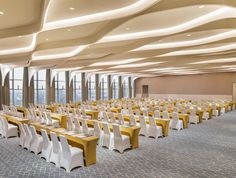 an empty banquet hall with tables and chairs