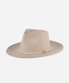 The Rowan is a fedora re-imagined. We've redesigned it with a taller crown + wider brim for a more dramatic take on a classic + timeless style. Featuring an attached genuine leather band, this hat is a statement piece on it's own. Classic Unlined Flat Brim Fedora, Classic Brimmed Unlined Fedora, Elegant Hats With Short Brim Unlined, Elegant Unlined Hats With Short Brim, Elegant Hats With Short Brim, Elegant Short Brim Unlined Hat, Spring Formal Fedora With Flat Crown, Elegant Curved Brim Hat, Classic Unlined Hat With Flat Brim