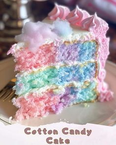 there is a piece of cake that has been made to look like rainbows and clouds