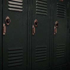 a row of black lockers sitting next to each other