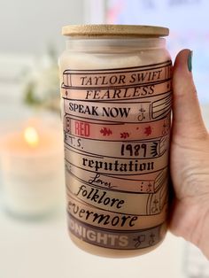 a person holding a jar with some type of label on it