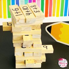 a stack of wooden blocks sitting on top of a table