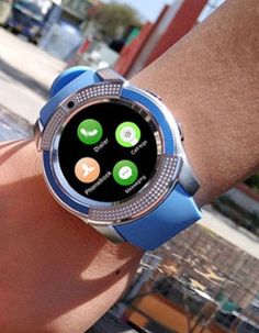 a person holding onto a smart watch on their wrist with different icons displayed on the screen