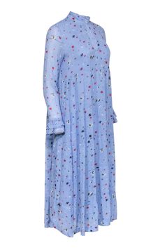 Let the garden come to you with this beautiful light blue Ganni dress! Boasting an eye-catching floral print detail, it's the perfect way to add a vibrant touch to your wardrobe. Dress up or down and enjoy the same stunning style! Size 4 (36) 100% Viscose Fully lined V-neckline Long sleeves Bust 42" Waist 50" Shoulder to hem 47" Sleeve length 23" Spring Daywear Maxi Dress With Ditsy Floral Print, Spring Maxi Dress With Ditsy Floral Print For Daywear, Blue Midi Dress With Ditsy Floral Print For Summer, Spring Blue Midi Dress With Ditsy Floral Print, Blue Ditsy Floral Print Midi Dress For Spring, Blue Midi Dress With Ditsy Floral Print For Spring, Light Blue Floral Dress For Spring, Light Blue Ditsy Floral Print Spring Dress, Blue Floral Print Midi Dress