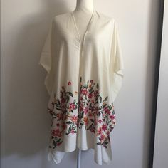 Sophisticated And Super Trendy Garden Embroidered Poncho. One Size, New Oversized V-neck Poncho For Spring, Spring Vacation V-neck Poncho, Cream Poncho One Size For Spring, Cream Poncho For Beach In Spring, Chic Beige Poncho For Spring, Chic Spring Poncho For Vacation, Embroidered Poncho, Cream Tops, Black Cream