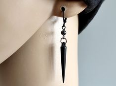 One spike earring, Spike black dangle, black matte spike, Punk earring, Hematite spike dangle, Gothic earring, Goth gift, Steampunk earring, Spike for youth, Gothic jewelry, Wow jewelry, youth accessory, youth earrings, guys earrings, for goth Single black matte color acrylic spike earring with round hematite bead 4 mm Total length 2 3/8 Inches ( 6,1 cm ). Earrings are really lightweight and comfortable to wear.  Choose suitable ear hook. One of the most unique and edgy fashion trends has got to Black Metal Spiked Jewelry, Black Gothic Jewelry With Spikes, Black Metal Jewelry With Spikes, Edgy Dangle Plug Earrings, Black Edgy Dangle Earrings, Edgy Black Dangle Earrings, Black Spiked Jewelry For Gifts, Black Spiked Jewelry As Gift, Black Spiked Jewelry Gift