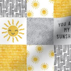 a yellow and white quilt with the words you are my sunshine on it