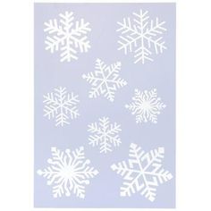 white snowflakes are arranged on a light blue background, with the shape of four different snowflakes