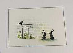 a painting of two rabbits sitting in front of a street sign with the words secret garden on it