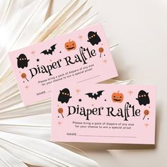 two pink halloween diaper raffle cards with black bats and pumpkins on them