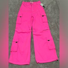 Nwt Hot Pink Cargo Pants. Size: Small These Pants Are Brand New And Have Never Been Worn! The Measurements Are Shown In The Pictures. If You Have Any Questions Please Reach Out. I Am Open To Reasonable Offers Pink Wide Leg Y2k Bottoms, Y2k Pink Straight Leg Bottoms, Y2k Pink Wide Leg Bottoms, Pink Wide Leg Y2k Pants, Y2k Pink Wide Leg Pants, Y2k Pink Jeans With Pockets, Y2k Style Pink Jeans With Pockets, Pink Y2k Style Wide Leg Pants, Y2k Wide Leg Pants With Side Pockets