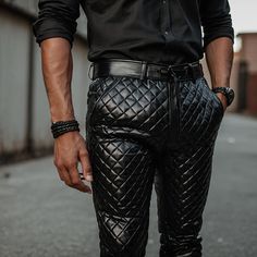 Step into luxury with our Men's Black Quilted Leather Pants featuring a sleek zipper closure. Crafted from genuine sheep lambskin leather, these pants offer a slim fit silhouette that combines style with comfort. Key Features: Handcrafted Excellence: Expertly crafted from soft sheep leather for superior quality. Quilted Design: Modern sophistication with a quilted pattern for added texture. Customizable Fit: Tailored options available for waist and leg sizes ensure a perfect fit. Slim Fit: A sle Mens Leather Pants, Leather Pant, Quilted Pattern, Sheep Leather, Men Fashion Casual Outfits, Black Quilt, Quilted Leather, Mens Trousers, Lambskin Leather