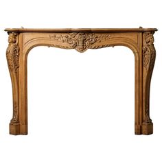 an antique fireplace mantel with carved wood and carvings on the mantle, isolated against a white background